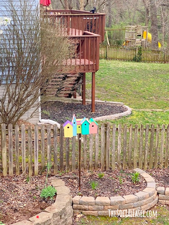 colorful painted birdhouses in the Yard