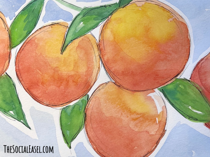 close up of a few of my Watercolor Oranges with a blue background