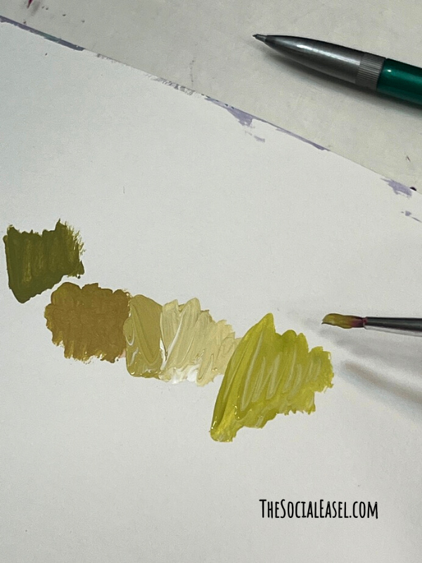 Different shades of green paint. 