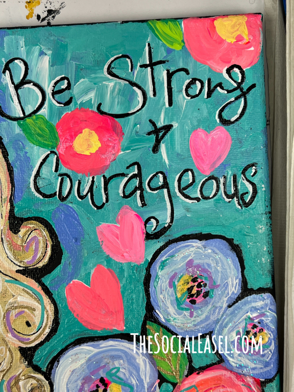 Painted canvas with hand painted lettering that says Be Strong & Courageous. 
