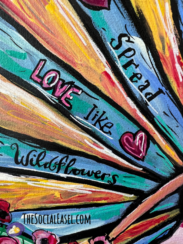 This canvas is showing an option for free hand lettering for your art. It says "Spread Love Like Wildflowers".